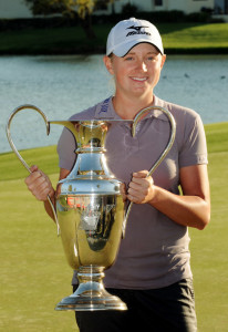 Stacy Lewis of the US, holds up the trop
